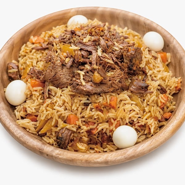 Plov, a traditional rice dish with shredded meat, carrots, and quail eggs in a wooden bowl.